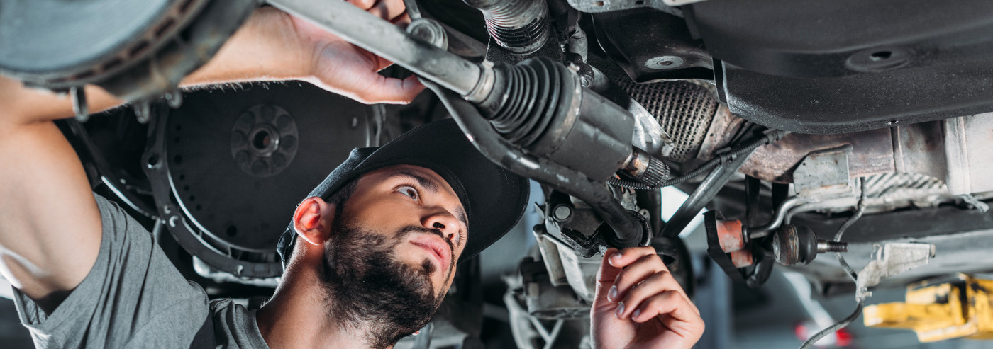 A mechanic looking inside a vehicle - Car Repairs Edenbridge