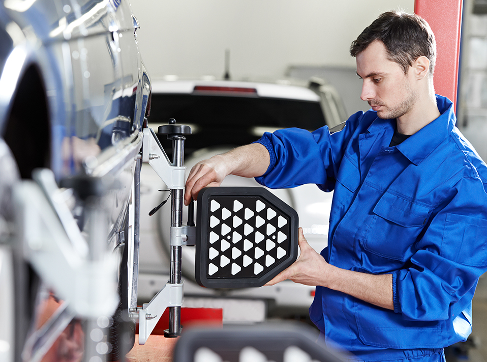 Mechanic aligning a vehicles wheels - Servicing, Tyres & Repairs Edenbridge